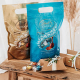Palline di cioccolato LINDOR con caramello salato | ca. 80 palline di cioccolato al latte con ripieno di caramello salato | Confezione sfusa e palline di cioccolato Marc de Champagne | 700 g