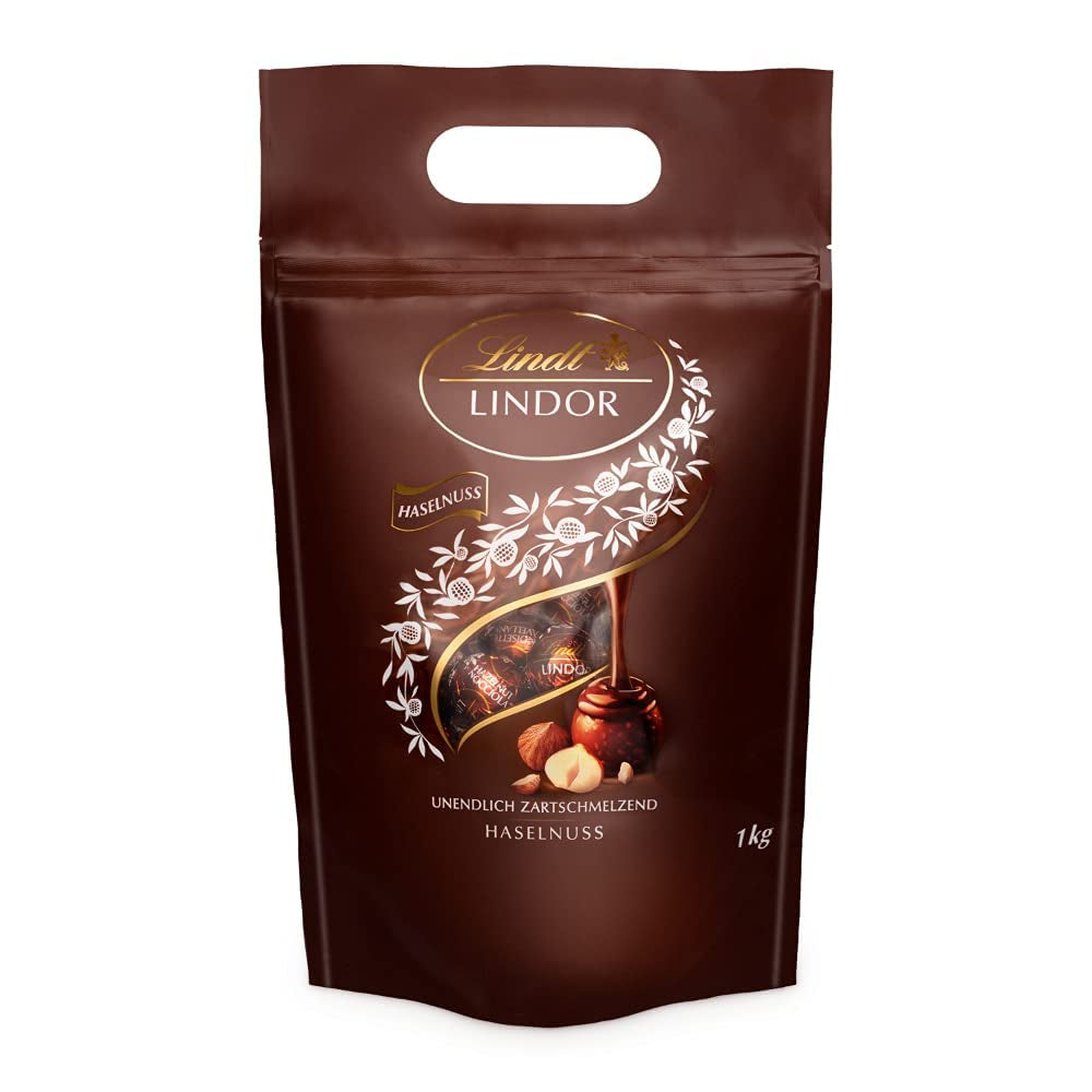 Palline di cioccolato LINDOR con nocciole, sacchetto da 1 kg + botte di Sherry Johnnie Walker da 0,7 litri