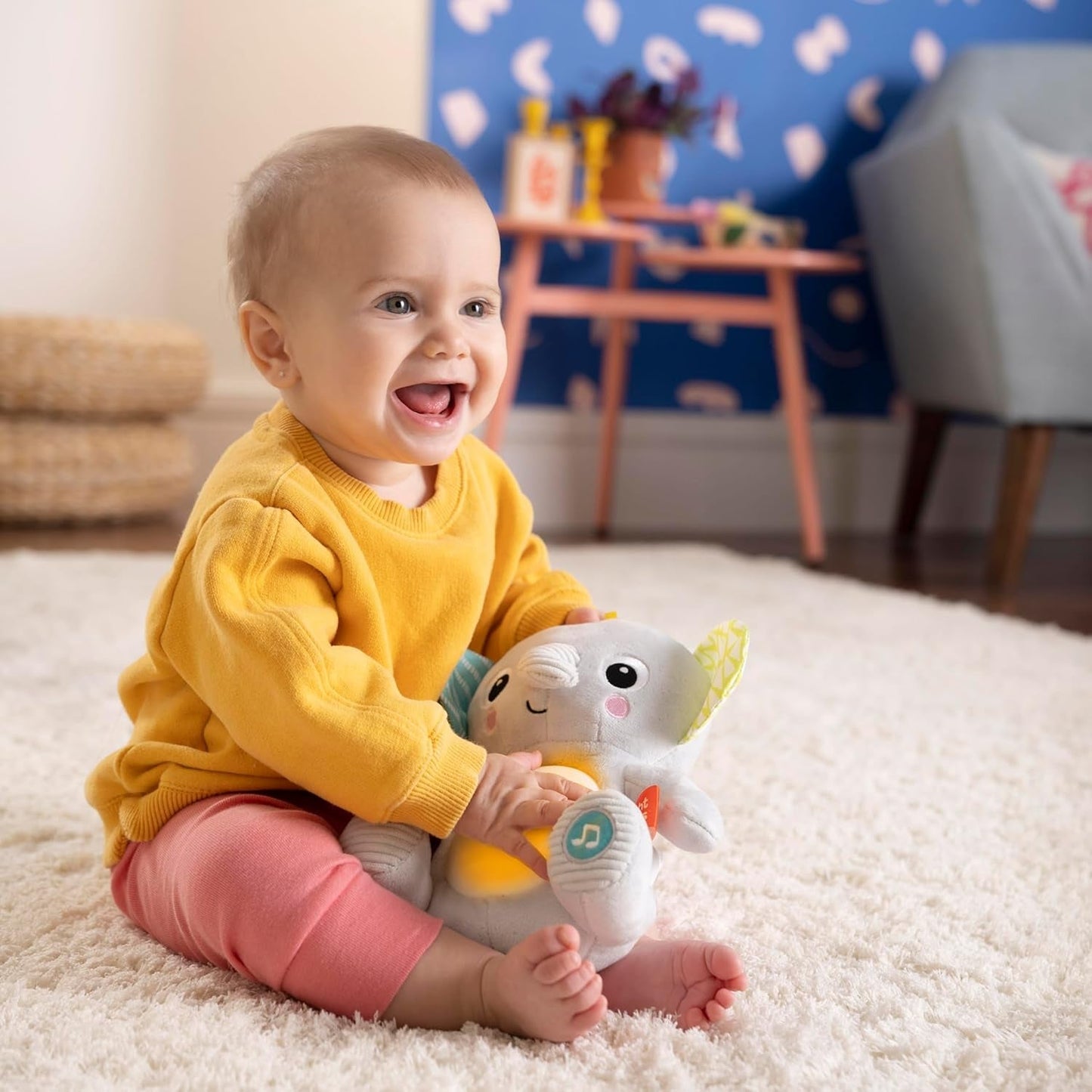 Bright Starts, Elefantino Hug-a-bye con luci, canzoni, texture diverse e altro, multicolore Toys Bebe Naty Shop