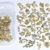 50 Stück Charms per unghie in oro, stili misti Glitzersteine ​​​​Nägel Perle Legierung Nagel Steine ​​​​Blume Schmetterling Strasssteine ​​​​Nägel Herz Stern Nagel Charms DIY Nail Art Zubehör Frauen Nägel Deko