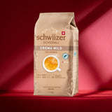Schwiizer Schüümli Crema Mild, chicchi di caffè 100% Arabica fini, armoniosi e delicati, ideale per macchine espresso automatiche, forza 2/5, tostatura chiara, Rainforest Alliance, 1kg