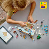 Carovana LEGO Friends, set da costruzione di gioco di ruolo con roulotte giocattolo, regalo per ragazze dai 7 anni in su, set di gioco creativo con 3 minifigure e figura dell'animale furetto 42663 Set da costruzione Besuche den LEGO-Store