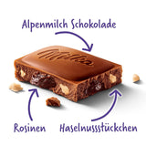 Milka Uva e Nocciole – Cioccolato al latte alpino con pezzi di nocciole e uvetta – 90g