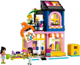 LEGO Friends Negozio di moda vintage Set da costruzione per bambini con negozio di giocattoli, personaggi e gatto, modello di gioco di ruolo per lo sviluppo socio-emotivo, regalo per bambine e bambini di 6 anni 42614 Set da costruzione Besuche den LEGO-Store