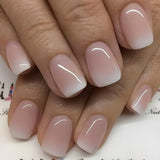 Set unghie finte adesive - Unghie finte francesi - 24 pezzi Design quadrato corto Unghie artificiali con sfumatura rosa bianca e manicure con ballerina (Short Pink Gradient)