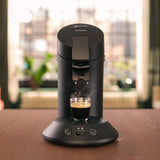 Macchina per caffè espresso a capsule PHILIPS Original Plus Eco, selezione dell'intensità del caffè, tecnologia Coffee Boost, 80% plastica riciclata*, consumo energetico ridotto del 45%**, 2 tazze contemporaneamente, nero pianoforte (CSA210/22)