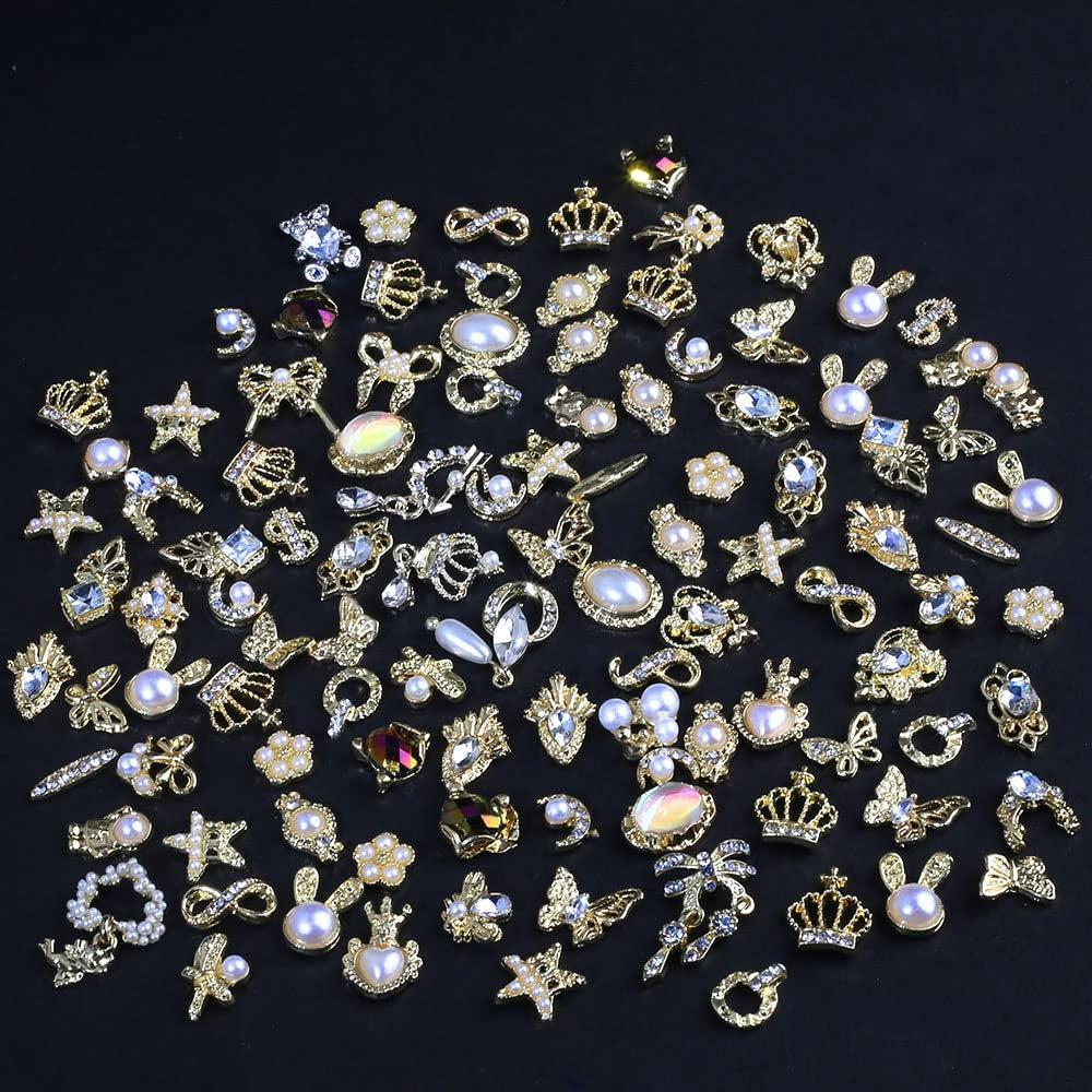 50 Stück Charms per unghie in oro, stili misti Glitzersteine ​​​​Nägel Perle Legierung Nagel Steine ​​​​Blume Schmetterling Strasssteine ​​​​Nägel Herz Stern Nagel Charms DIY Nail Art Zubehör Frauen Nägel Deko