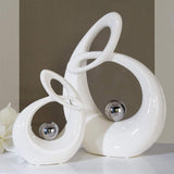 GILDE Scultura decorativa in ceramica Vita - figura bianca smaltata bianco/argento con palla argento - altezza 22 cm Statue e sculture Naty Shop