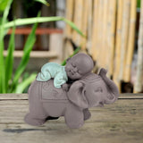 Zen'Light Statua Buddha Bonzo che dorme sull'Elefante - Atmosfera Zen nel tuo spazio sacro - bellissima figura di buon auspicio -H 9,5 cm, Marrone e Verde Statue e sculture Naty Shop