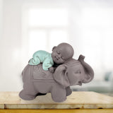 Zen'Light Statua Buddha Bonzo che dorme sull'Elefante - Atmosfera Zen nel tuo spazio sacro - bellissima figura di buon auspicio -H 9,5 cm, Marrone e Verde Statue e sculture Naty Shop